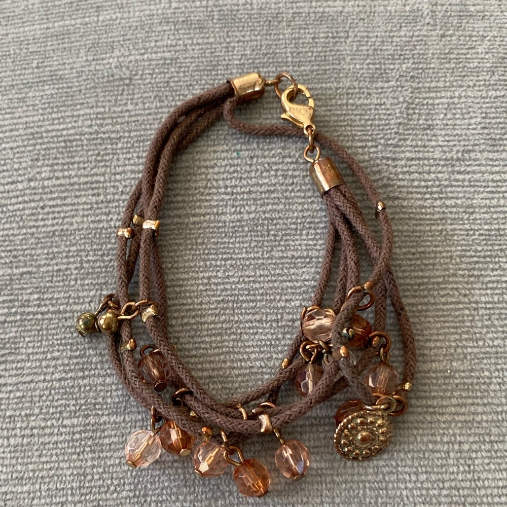 Vintage Bracelet – multi strand brown cord with peach,clear, gold beads.